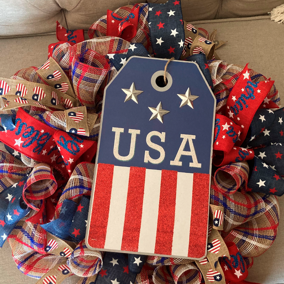 red, white, blue wreath made our of ribbons