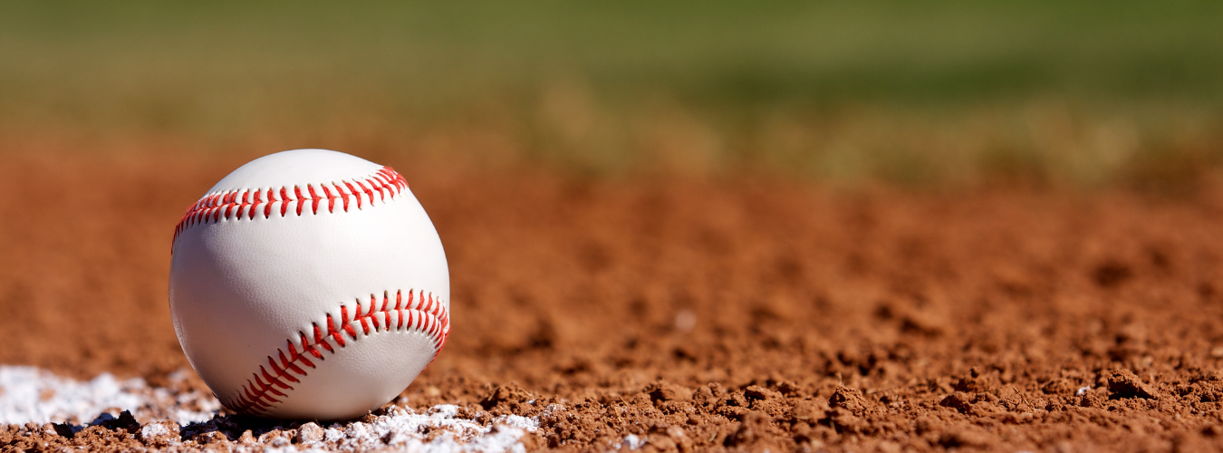 close up shot of a baseball on a baseball field