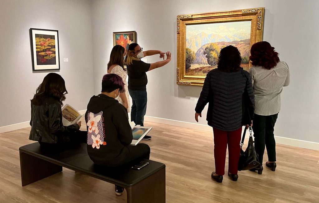 museum-attendees-viewing-art